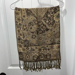 Beautiful gold and brown scarf. Fringe on the ends of the scarf.